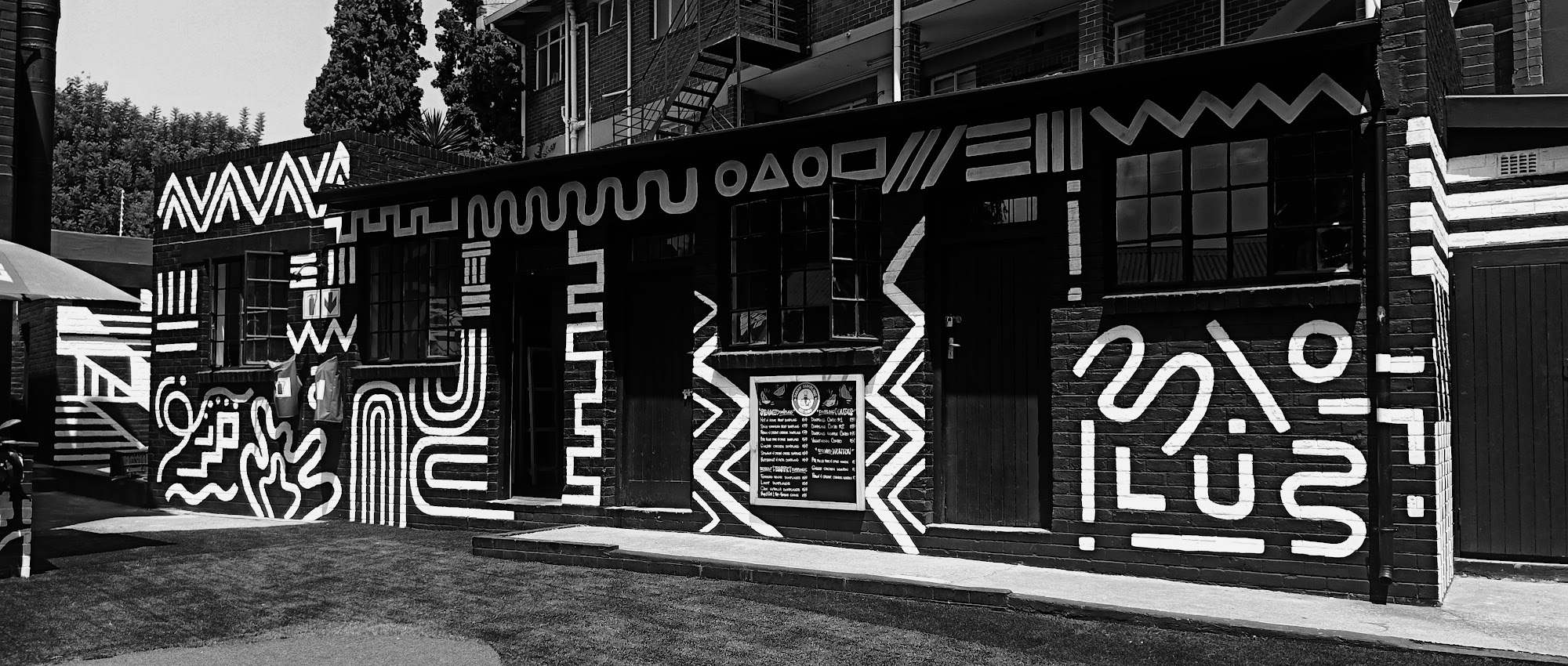 Geometric Facade — mural in Shopfront Exterior