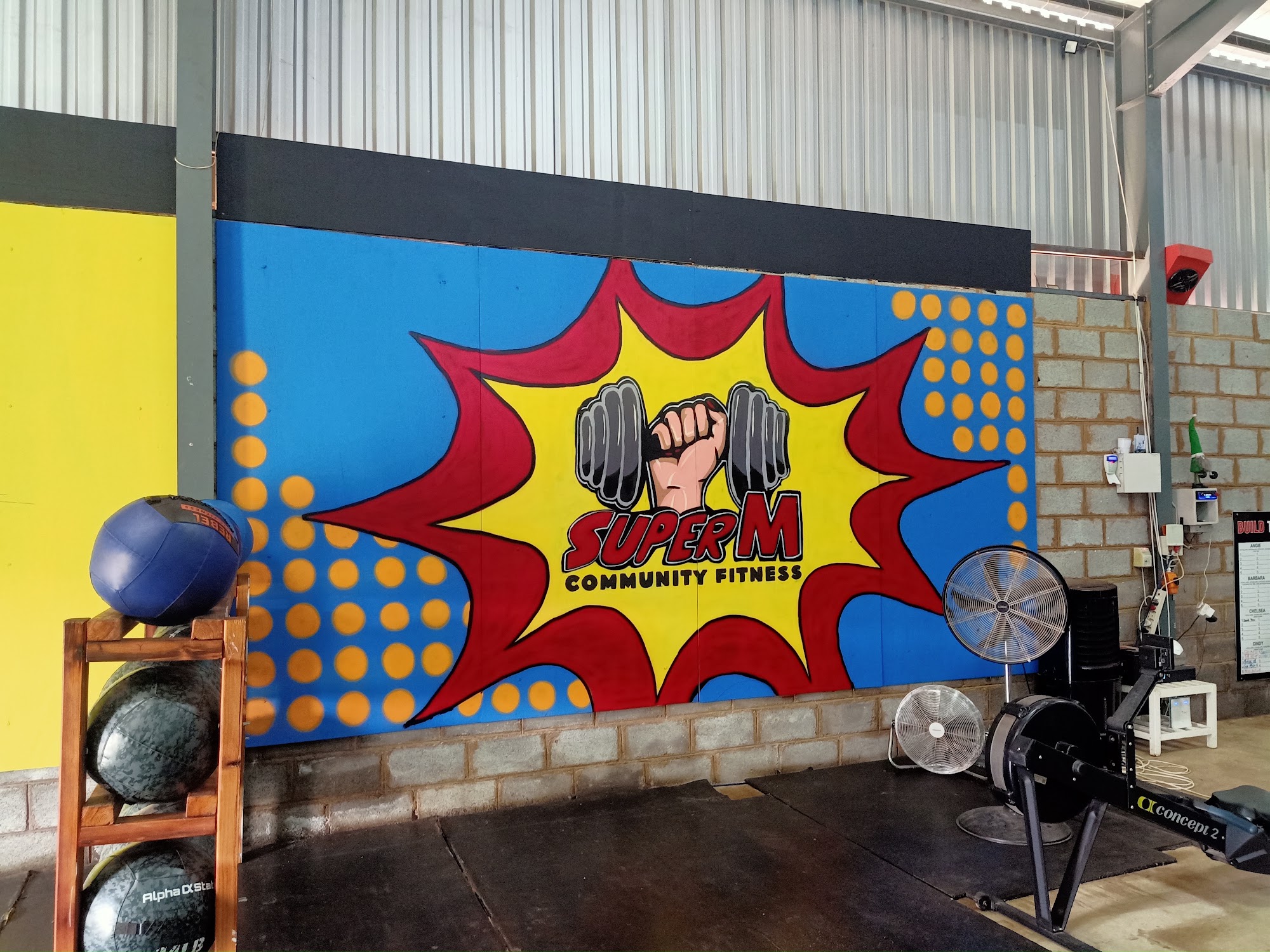 Super M Community Fitness — mural in Gym Feature Wall
